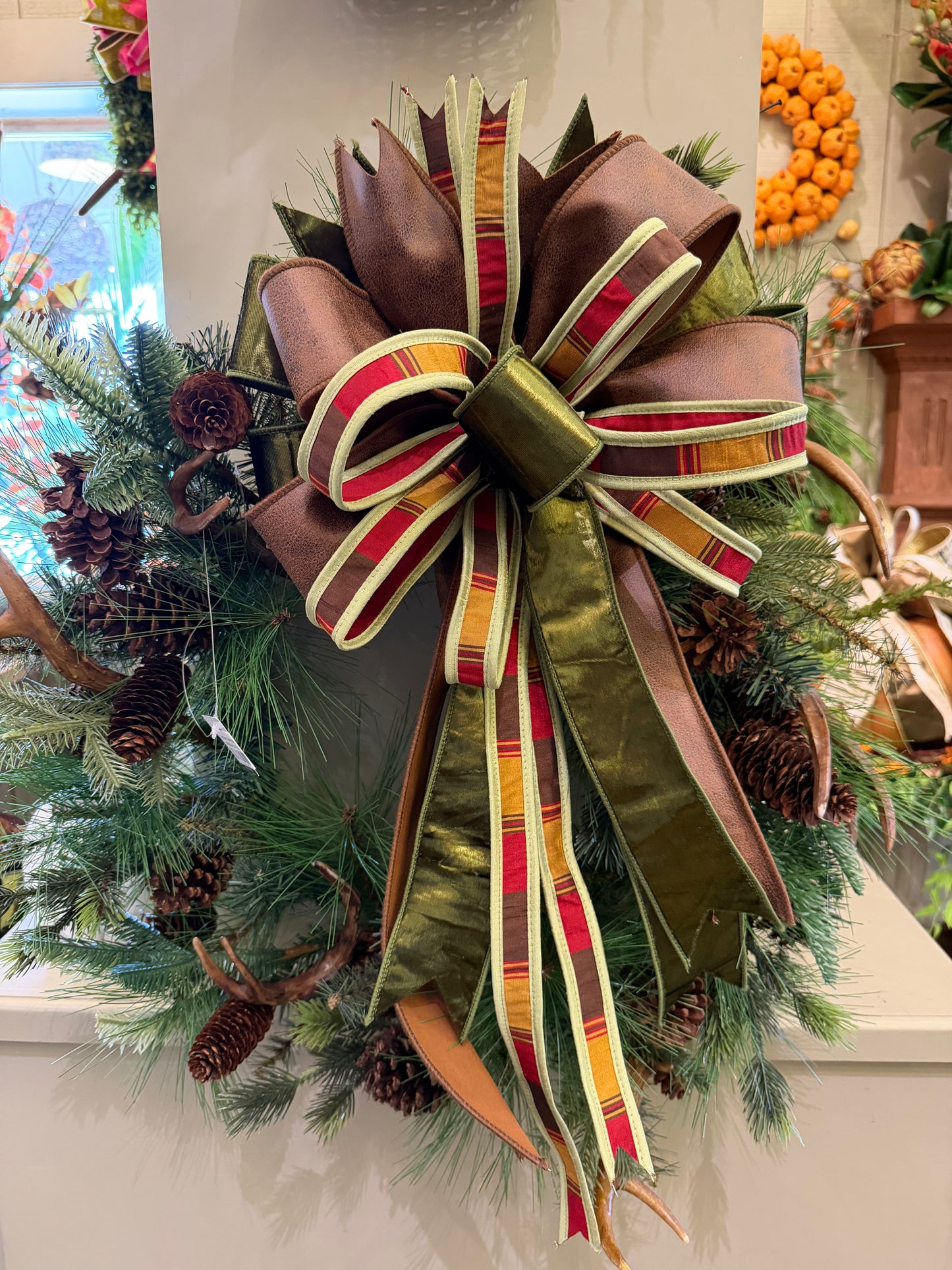 Bow with Leather and Green Striped Ribbon